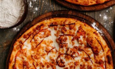 front-view-pizza-with-cheese-wooden-rustic-floor