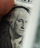 Recorte de nota de dólar com rosto de George Washington