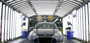 A Ford Focus goes through quality inspection on the assembly line at Ford Motor Co.'s Michigan Assembly Plant December 14, 2011 in Wayne, Michigan. Ford released details about the electrification of the Michigan Assembly Plant that will power production in part by one of the largest solar energy generator systems in order to produce their new C-MAX Hybrid and C-MAX Energi electric vehicles. (Photo: Bill Pugliano/Getty Images)