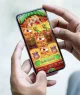 Celular exibindo tela do jogo de apostas online Fortune Tiger, popularmente conhecido como "Jogo do Tigrinho"